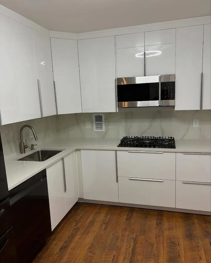 Restored kitchen with white cabinets after water damage in Heathrow